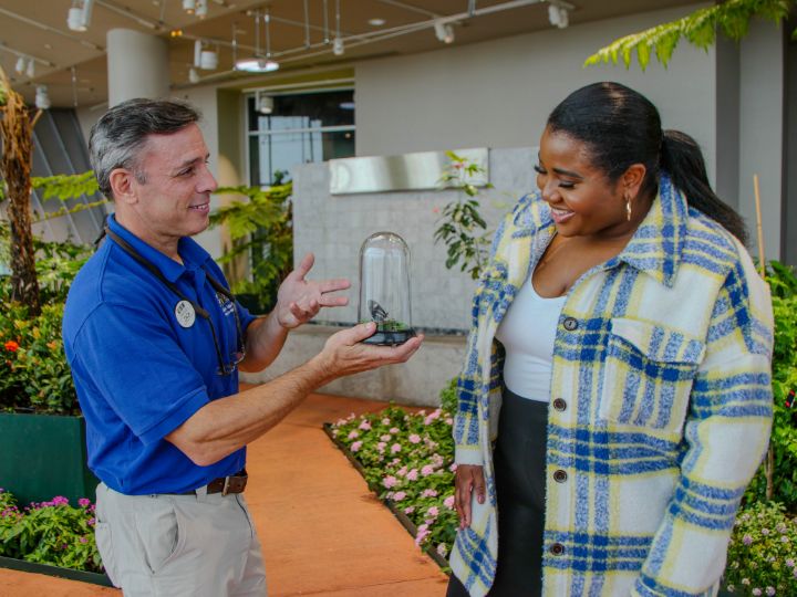 A guest doing the Butterfly First Flight Wild Encounter at Audubon Insectarium