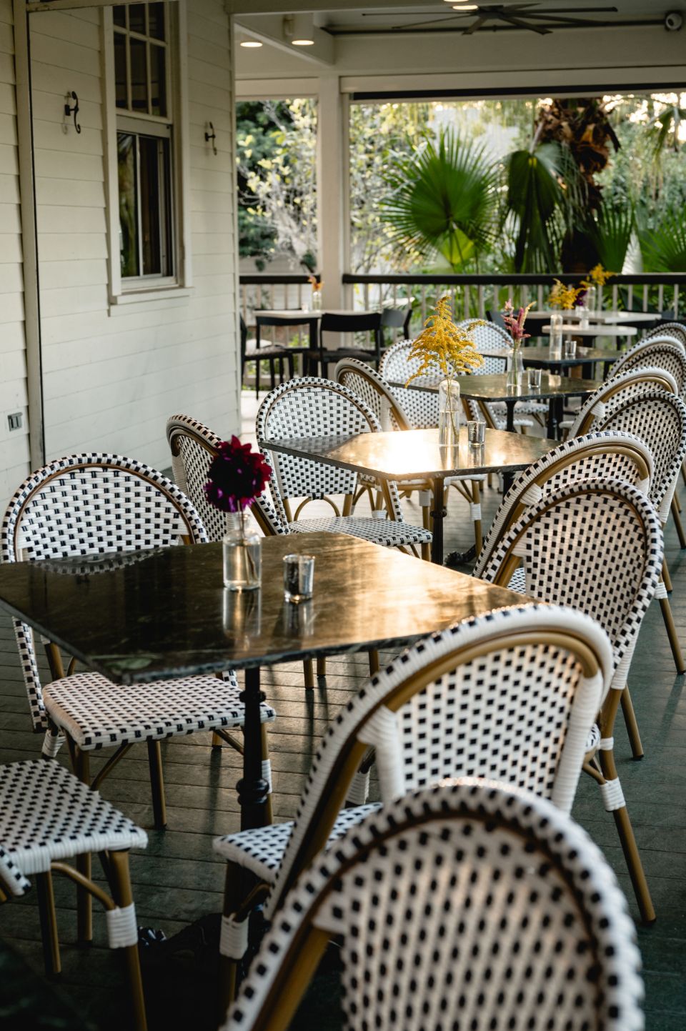 Tables on an outdoor patio at Audubon Clubhouse in New Orleans
